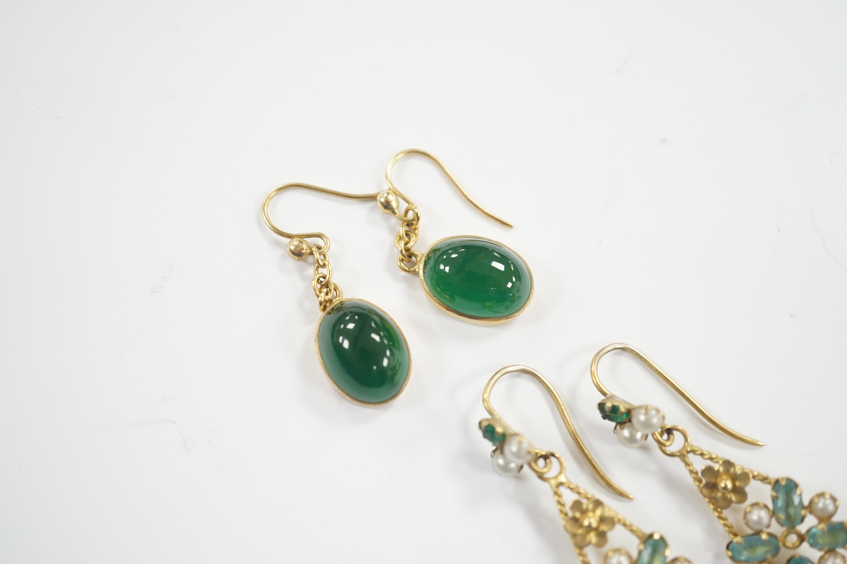 A pair of yellow metal and cabochon chrysoprase set drop earrings and a pair of yellow metal, aquamarine coloured stone and split pearl cluster set drop earrings, gross weight 5.6 grams.